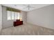 Comfortable bedroom with ceiling fan and chest by window at 68 Vista Del Mar St, Henderson, NV 89012