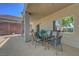 Covered patio features a dining set and offers a relaxing outdoor space at 68 Vista Del Mar St, Henderson, NV 89012