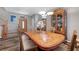 Dining room boasts a wood table and a view of the front door and ornate furniture at 68 Vista Del Mar St, Henderson, NV 89012