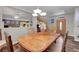 Dining room features a wooden table with seating for four, opening up to a kitchen and front entryway at 68 Vista Del Mar St, Henderson, NV 89012