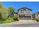 Beautiful two-story home featuring a two-car garage and manicured landscaping at 68 Vista Del Mar St, Henderson, NV 89012