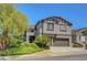 Charming home featuring a two car garage and meticulously maintained landscaped front yard at 68 Vista Del Mar St, Henderson, NV 89012