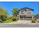 Two story home featuring a two car garage, landscaped front yard and inviting curb appeal at 68 Vista Del Mar St, Henderson, NV 89012