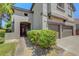 Charming home exterior with a walkway leading to the front door and attached two-car garage at 68 Vista Del Mar St, Henderson, NV 89012