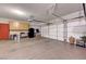 Spacious two car garage featuring ample storage cabinets and epoxy flooring at 68 Vista Del Mar St, Henderson, NV 89012