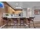 Kitchen with granite countertops, stainless steel appliances, and bar seating at 68 Vista Del Mar St, Henderson, NV 89012