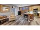 Open kitchen featuring a breakfast bar, stainless steel appliances, wood-look floors, and lots of natural light at 68 Vista Del Mar St, Henderson, NV 89012
