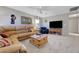 Inviting living room featuring comfortable leather seating and a rustic wooden coffee table at 68 Vista Del Mar St, Henderson, NV 89012