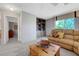 Cozy living room with a built-in bookcase, a large window, and comfortable seating at 68 Vista Del Mar St, Henderson, NV 89012