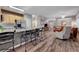 Spacious living room with wood flooring and bar seating attached to the kitchen at 68 Vista Del Mar St, Henderson, NV 89012