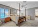 Bright main bedroom with ample natural light, featuring a four-poster bed at 68 Vista Del Mar St, Henderson, NV 89012