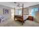 Comfortable main bedroom with a four-poster bed and an en-suite bathroom at 68 Vista Del Mar St, Henderson, NV 89012