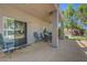 Covered patio with nice stone pillars and view of the landscaped backyard at 68 Vista Del Mar St, Henderson, NV 89012
