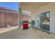 Covered patio with BBQ grill and access to home through sliding glass door at 68 Vista Del Mar St, Henderson, NV 89012