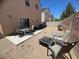 The backyard features a gravel landscape, patio, seating area, and block wall at 6922 Majestic Palm Dr, Las Vegas, NV 89122