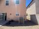 This backyard features a gravel landscape, patio, air conditioning condenser, and block wall at 6922 Majestic Palm Dr, Las Vegas, NV 89122