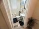 Half bathroom with toilet, sink and modern decor at 6922 Majestic Palm Dr, Las Vegas, NV 89122