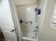 Bathroom shower and tub combo with white tile and curtain at 6922 Majestic Palm Dr, Las Vegas, NV 89122