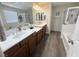 Bathroom with a double sink vanity and a shower over tub with glass door at 6922 Majestic Palm Dr, Las Vegas, NV 89122