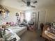 Bedroom with carpet, ceiling fan, and plentiful decor and furnishings at 6922 Majestic Palm Dr, Las Vegas, NV 89122