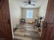 Bedroom with wood floors and a ceiling fan, featuring barn doors, and pet toys at 6922 Majestic Palm Dr, Las Vegas, NV 89122