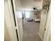 Spacious bedroom featuring a ceiling fan, neutral carpeting, and a view from the doorway at 6922 Majestic Palm Dr, Las Vegas, NV 89122