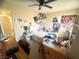 Cozy bedroom featuring a ceiling fan and adorned with various decorations and posters at 6922 Majestic Palm Dr, Las Vegas, NV 89122