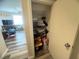 Walk in closet with overhead storage and cleaning supplies at 6922 Majestic Palm Dr, Las Vegas, NV 89122