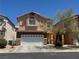 Charming two-story home showcasing a well-maintained front yard and attached two car garage at 6922 Majestic Palm Dr, Las Vegas, NV 89122