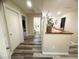 Hallway with wood-style vinyl floors leading to different rooms of the house at 6922 Majestic Palm Dr, Las Vegas, NV 89122