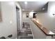 Hallway with attractive wood-look floors, neutral paint, and decorative art and a view of a dog at 6922 Majestic Palm Dr, Las Vegas, NV 89122