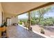Relaxing covered patio with views of lush landscaping and an iron fence at 693 Hagens Aly, Mesquite, NV 89027
