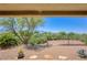 Picturesque backyard showcasing lush landscaping, a beautiful view of mountains and an iron fence at 693 Hagens Aly, Mesquite, NV 89027