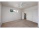 Bedroom with a ceiling fan and two closets with doors leading to additional storage at 693 Hagens Aly, Mesquite, NV 89027