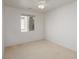 Bedroom features a ceiling fan and a window with backyard view at 693 Hagens Aly, Mesquite, NV 89027