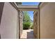 Charming front entrance with stone details, offering a glimpse of the well-maintained front yard at 693 Hagens Aly, Mesquite, NV 89027