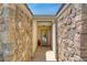 Inviting front entrance with stone accents and a covered entryway. Perfect for curb appeal at 693 Hagens Aly, Mesquite, NV 89027