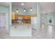Open kitchen featuring wood cabinets, granite countertops, and tile flooring at 693 Hagens Aly, Mesquite, NV 89027