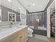 Modern bathroom with a large vanity and a shower-over-tub, offering a clean and comfortable space at 7952 Lonette Ave, Las Vegas, NV 89147