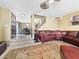 Cozy living room with a leather sofa and view of the dining area at 7952 Lonette Ave, Las Vegas, NV 89147