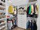 Spacious walk-in closet featuring ample hanging rods and shelves, perfect for organizing clothes and shoes at 7952 Lonette Ave, Las Vegas, NV 89147
