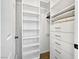 Bright walk-in closet with built-in shelving, drawers, and plenty of storage space for an organized wardrobe at 7952 Lonette Ave, Las Vegas, NV 89147