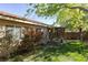 Well-maintained backyard with a wooden patio area and ample green space, ideal for outdoor living at 8213 Cabin Springs Ave, Las Vegas, NV 89131