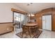 Cozy kitchen includes warm wood cabinets, tiled flooring, and a casual dining area at 8213 Cabin Springs Ave, Las Vegas, NV 89131