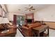 Living room has tile flooring, a ceiling fan and a fireplace at 8213 Cabin Springs Ave, Las Vegas, NV 89131