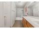 Bathroom with extended vanity, large mirror, and shower/tub combination with sliding glass doors at 89 Day Trade St # 1, Henderson, NV 89074