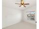 Bright bedroom with neutral walls, carpet, ceiling fan and a window bringing in natural light at 89 Day Trade St # 1, Henderson, NV 89074