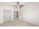 Bedroom with carpeted floors, a ceiling fan, and a double door closet at 89 Day Trade St # 1, Henderson, NV 89074