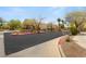 View of community entrance with manicured landscaping and signage indicating on-street parking regulations at 89 Day Trade St # 1, Henderson, NV 89074