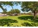 Lush community green space featuring mature trees and landscaping, providing a serene outdoor environment at 89 Day Trade St # 1, Henderson, NV 89074
